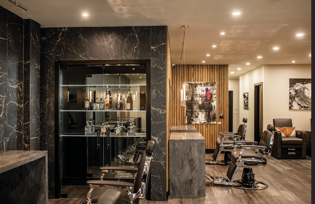 CAVE barbershop interior with marble walls and barber chairs